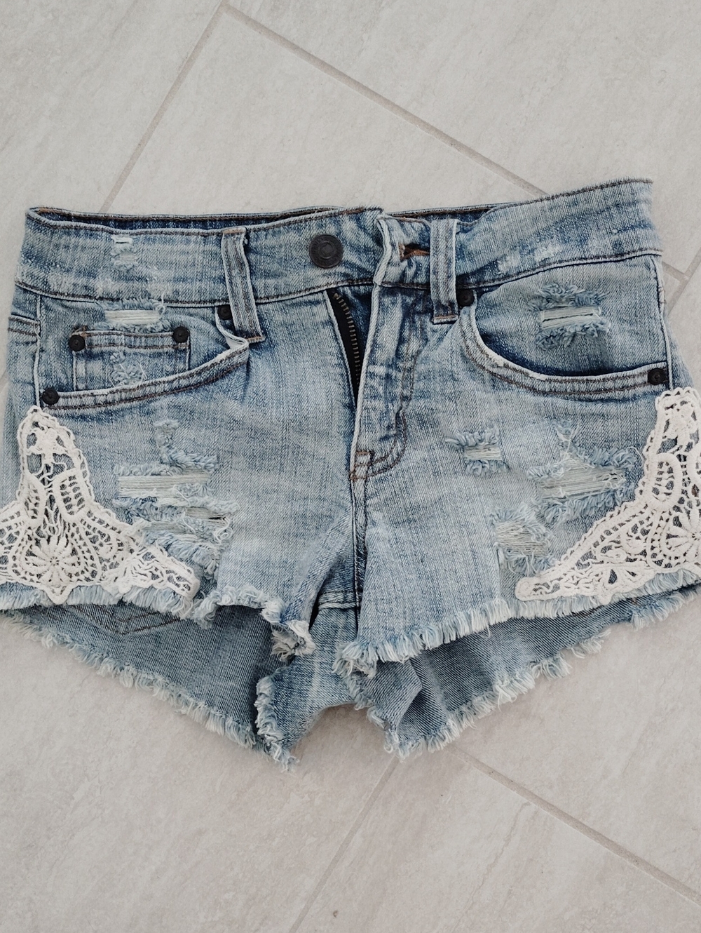 Distressed Mid Rise Shorts With Lace
